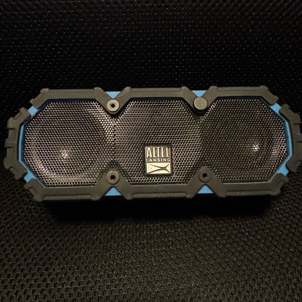 Altec Lansing Bluetooth speaker, works as it should. Just don’t have charger.
